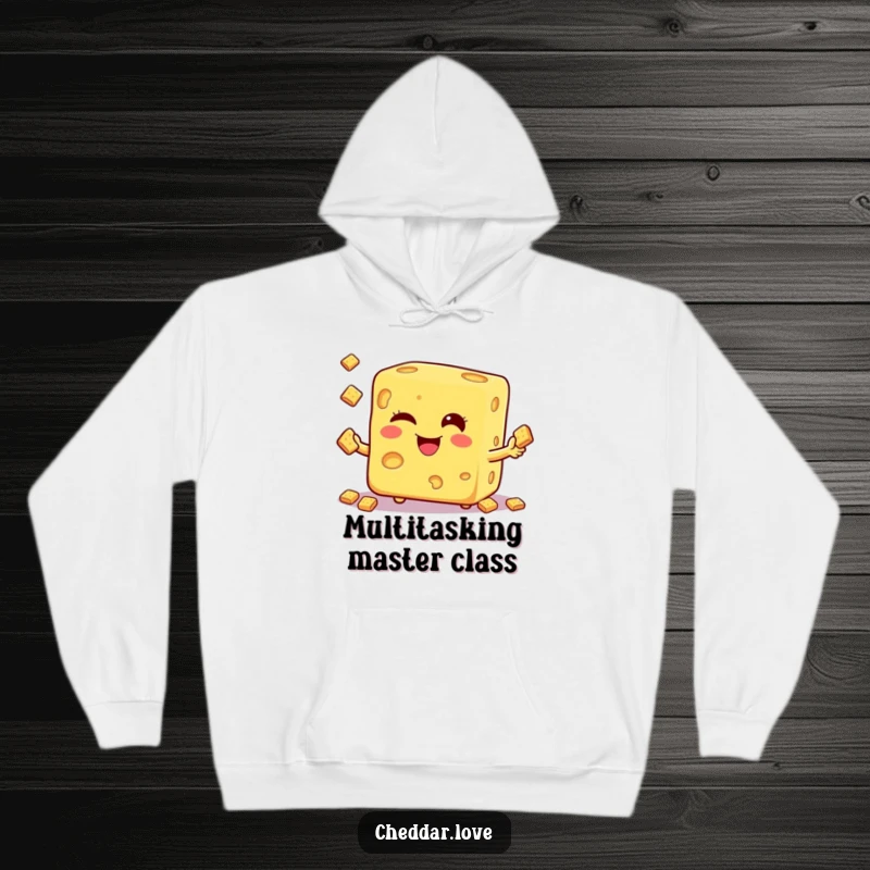 Funny hoodie with a winking cheese cube performing a juggling trick with small crackers, offering warmth and humor.