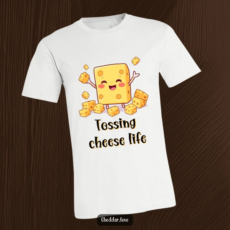 Funny Cheddar Cheese T-Shirt depicting a smiling block expertly juggling smaller cheese cubes with glee.